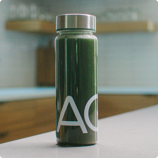 A glass of AG1 on a kitchen counter