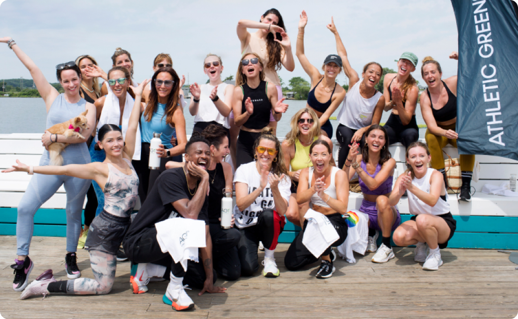 AG1 community celebrating together on a dock